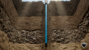 Soil probe going through layers of soil and dirt